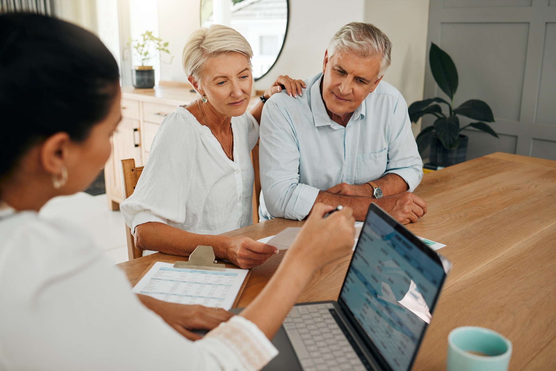 Financial advisor consultation with clients on retirement, finance planning or investment and document on laptop screen. Accountant woman, senior people and pension advice, asset management or budget